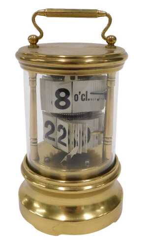 An early 20thC Plato style brass cased ticket desk jump hour clock, of cylindrical form, with...
