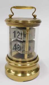 An early 20thC Plato style brass cased ticket desk jump hour clock, of cylindrical form, with... - 2
