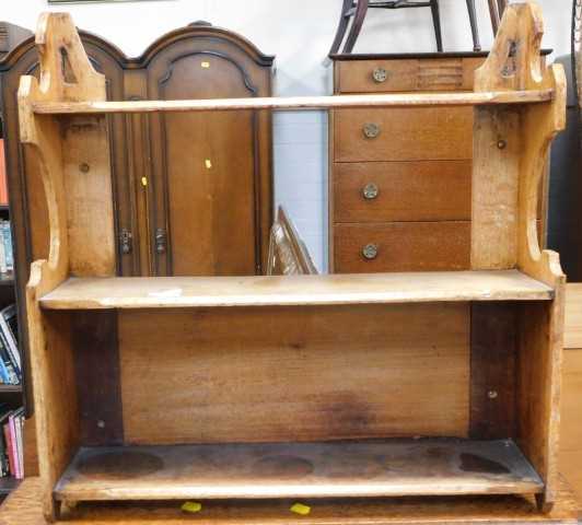 A late 19th/early 20thC oak wall shelf, with shaped sides, 61cm wide.