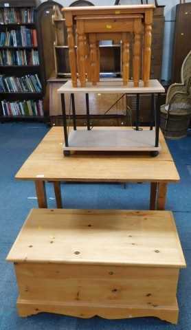 An oak drop leaf table, nest of three tables, pine blanket box, and a TV stand. (4)