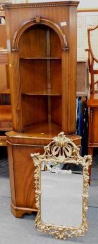 A walnut standing corner cabinet, the open top with two shelves above a door, 65cm wide, and a...