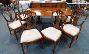 A mahogany dining suite, comprising a serpentine fronted sideboard, an extending dining table...