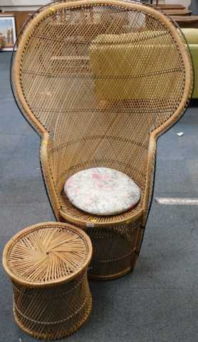 A rattan peacock armchair, with ebonised borders and a matching stool. (2)