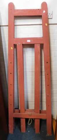 Two blackboard easels, lacking pegs.