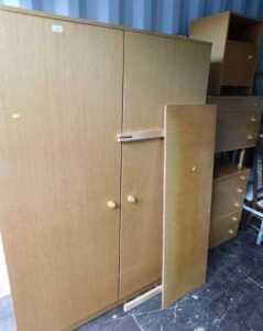 A 1970s Avalon teak bedroom suite, comprising double wardrobe, headboard, chest of four drawers,...
