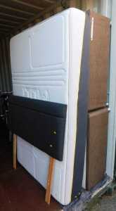 A double divan bed, with headboard and a M Lily Premier 2000 mattress.