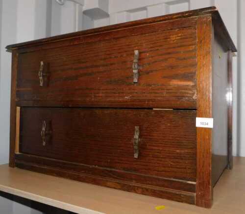 An oak chest, of two long drawers.