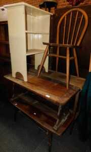 Furniture, comprising a kitchen chair, raised on turned supports, a cream painted open shelf...