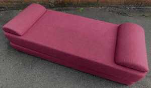 A modern red upholstered daybed, on ebonised feet, 74cm high, 188cm long, 225cm wide. - 2