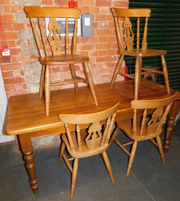 A pine dining table, together with four beech dining chairs. (5)