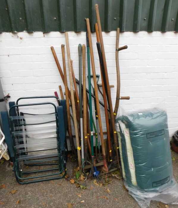 A quantity of garden tools, two garden chairs, etc.
