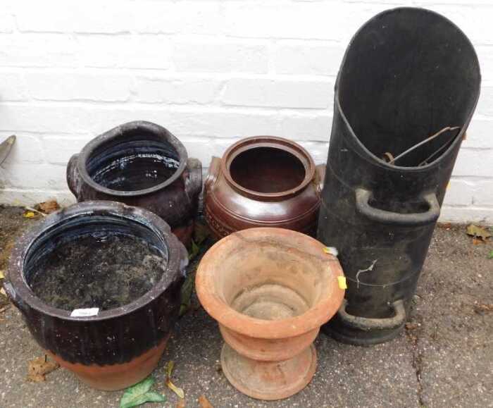 Three stoneware twin handled jars, each approx 27cm high, a terracotta urn, (AF), a paraffin...