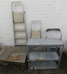 A galvanised three tier shelf, a wheelbarrow, three sets of step ladders. (5)