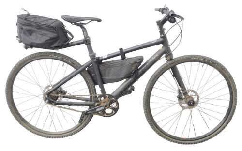 A Cannondale single speed hybrid bike, with a Lefty left pipe fork, Alvis disc brakes, and...
