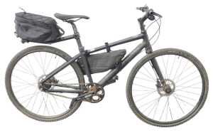 A Cannondale single speed hybrid bike, with a Lefty left pipe fork, Alvis disc brakes, and...