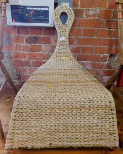A wicker rocking chair.