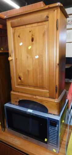 A Panasonic Invertor microwave, together with a pine bedside cupboard, 45cm wide. (2)
