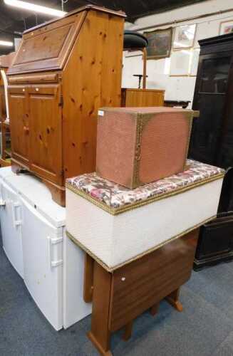 A pine bureau, 28cm high, 83cm wide, together with a Lloyd Loom style ottoman, Lloyd Loom style...