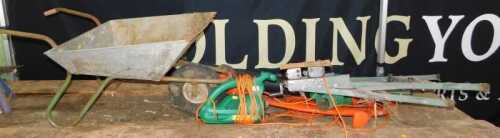 A Flymo Revolution 2000 strimmer, Black & Decker electric leaf blower, a wheelbarrow, and a work...