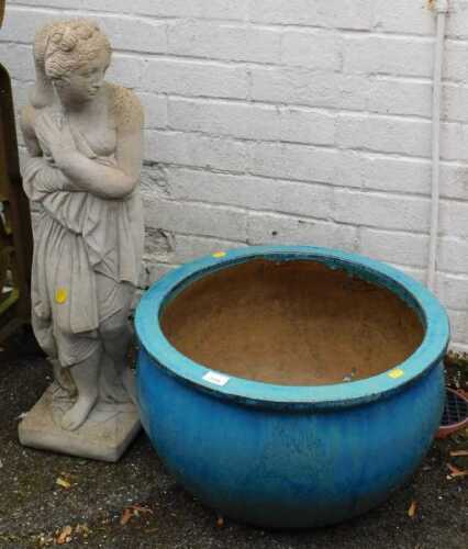A blue glazed stoneware flower pot, 52cm wide, together with a concrete garden ornament,...