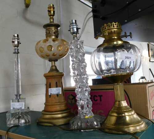 A Continental gilt metal beech and glass table lamp, constructed from various oil lamp and other...