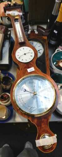 A Comitti of London mahogany cased Sheraton Revival wall clock, the circular white enamel dial...