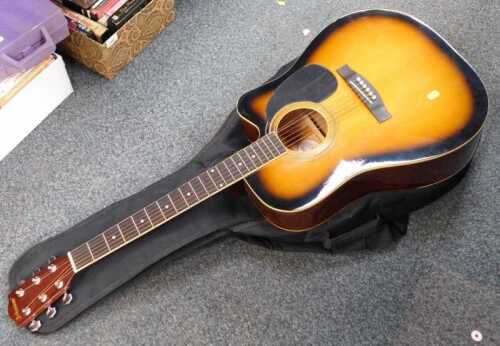 A Johnson acoustic guitar by AXL, model JG-620-CS, in soft shell case.