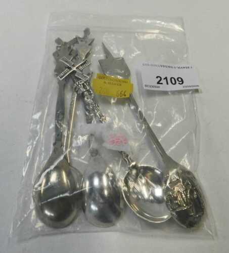 A group of white metal spoons, to include three Dutch examples, each terminal decorated with a...