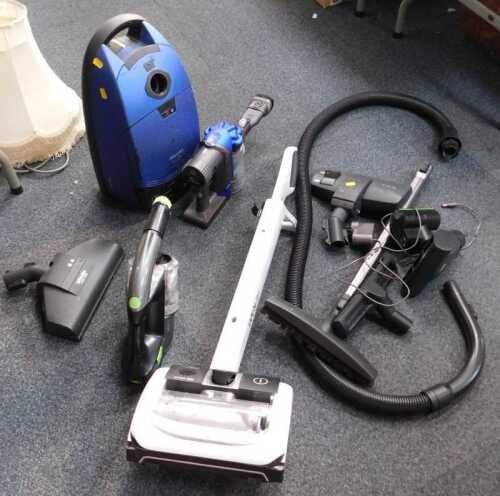 A Miele Solution Hepa TT2000 vacuum cleaner, a Dyson DC31, and a G-Tec Multi.