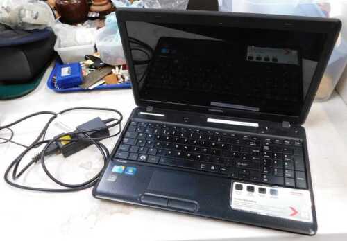 A Toshiba satelitte C660/C660D laptop computer, with charger.