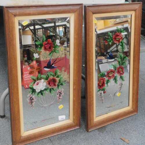 Two painted mirrors, each depicting an urn containing flowers with a bird, contained in an oak...