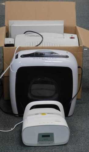 A Rexel P20 binding machine, together with Rexel shredder, and a Smith style MP3 and CD player.