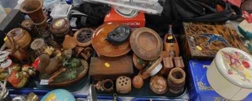 A collection of carved treen, comprising goblets, Russian dolls, squirrel and mouse ornamental...
