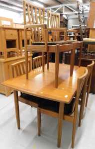 A Meredew style teak extending dining table and six chairs (4+2), each in overstuffed corduroy...