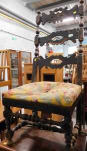 A late 19thC French beech stained ladder back chair, with elaborate pierced horizontal splats,...