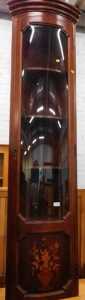 An Italian free-standing cylindrical corner cupboard, inlaid with vase of flowers.
