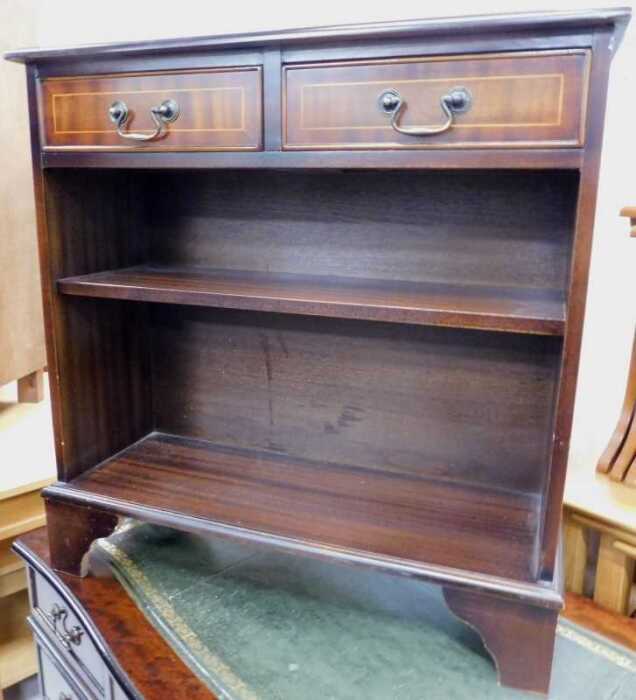 A mahogany finish open side cabinet, with two drawers above open shelves on bracket feet.