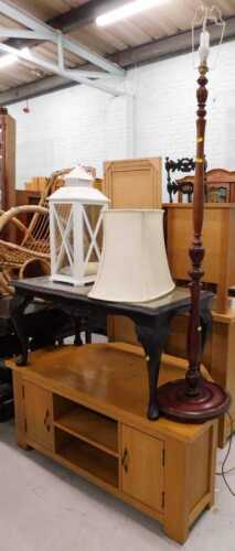 Various furniture, standard lamp, hanging lantern, coffee table, and a light oak TV stand.