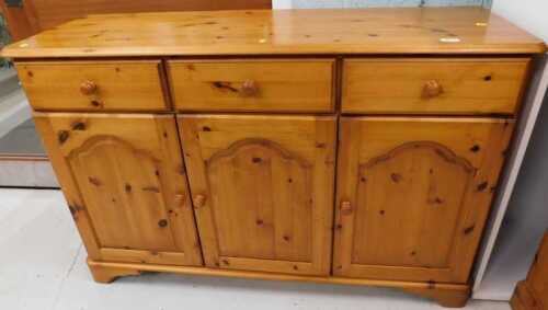 A pine side cabinet.