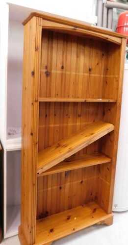 A pine freestanding open bookcase, with adjustable shelves, and another.