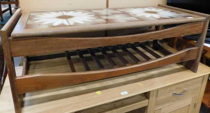 A G-plan style teak coffee table, with floral tile top.