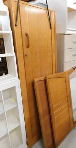 An EG Gomme light oak single wardrobe, with shaped handle, and a similar design single bed.