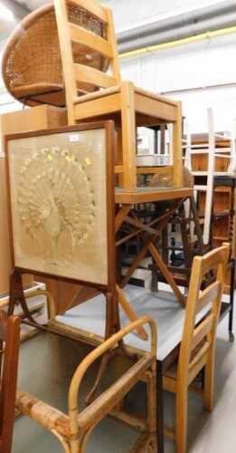 An early 20thC firescreen, with embroidered peacock design, two tier wicker trolley, various...