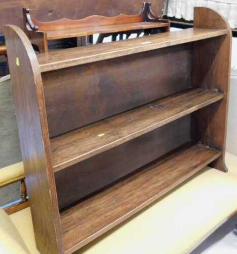 An oak bookcase, and a mahogany hanging bookcase.