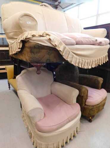 A three piece lounge suite, comprising three seater sofa and two armchairs, in floral and cream...