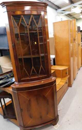 A 1960s bird's eye maple three piece bedroom suite, comprising two wardrobes, mirror back...