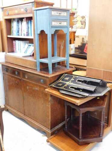 A yew wood finish open bookcase, with single drawer above open shelves, with a quantity of books,...