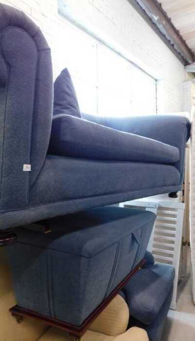 A three-piece lounge suite, comprising two seater Chesterfield sofa, single armchair and ottoman.