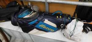 Various golf clubs, a Howson bag containing a quantity of golf clubs, Trilogy driver, various...