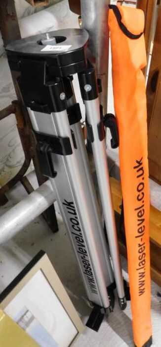 A laser level with theodolite style metal stand.